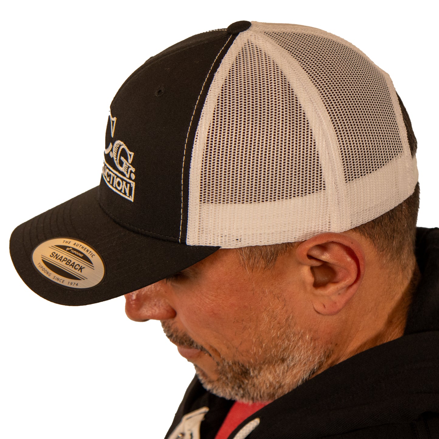 Left side view of VCG Construction black and white snapback hat