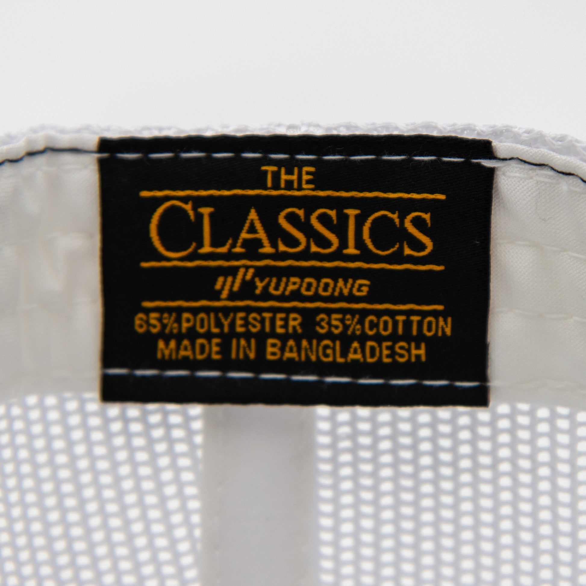 Yupoong tag inside VCG Construction black and white snapback hat