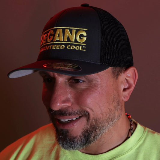 Elevate your headwear game with the distinctive style of our two-tone Black and Grey Flexfit Trucker Mesh Cap, featuring the vibrant Yellow DeGANG GUARANTEED COOL logo meticulously embroidered.