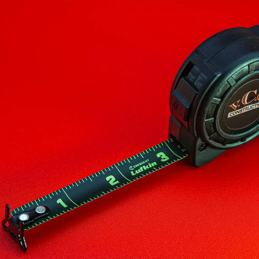 Elevate your precision wherever you go with the 1/2in x 8' Shockforce Nite Eye Tape Measure on a key chain – a compact powerhouse adorned with the VCG Construction logo, adding a touch of professional pride to your toolkit