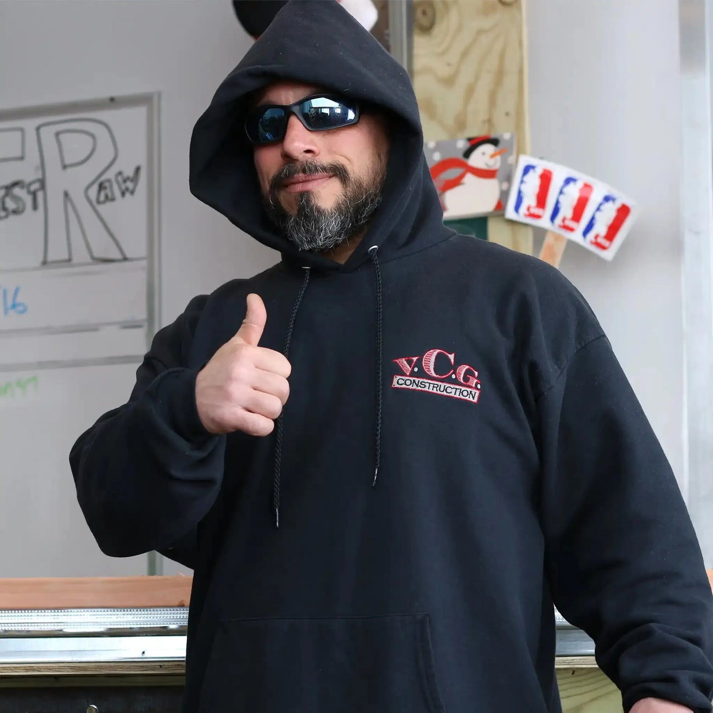 Hoodie Up view of the VCG Construction Logo Embroidered Black Hoodie – Elevate your streetwear game with this iconic, embroidered hoodie from the #VeryCoolGang