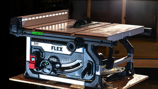 The Flex 10" 24V Cordless Table Saw FX 7221-Z set up on a workbench, showcasing its robust design and portable frame
