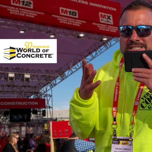 Enthusiastic presenter at World of Concrete event with Milwaukee MX FUEL™ Equipment System booth in the background, showcasing 50 years of industry innovation and expertise.