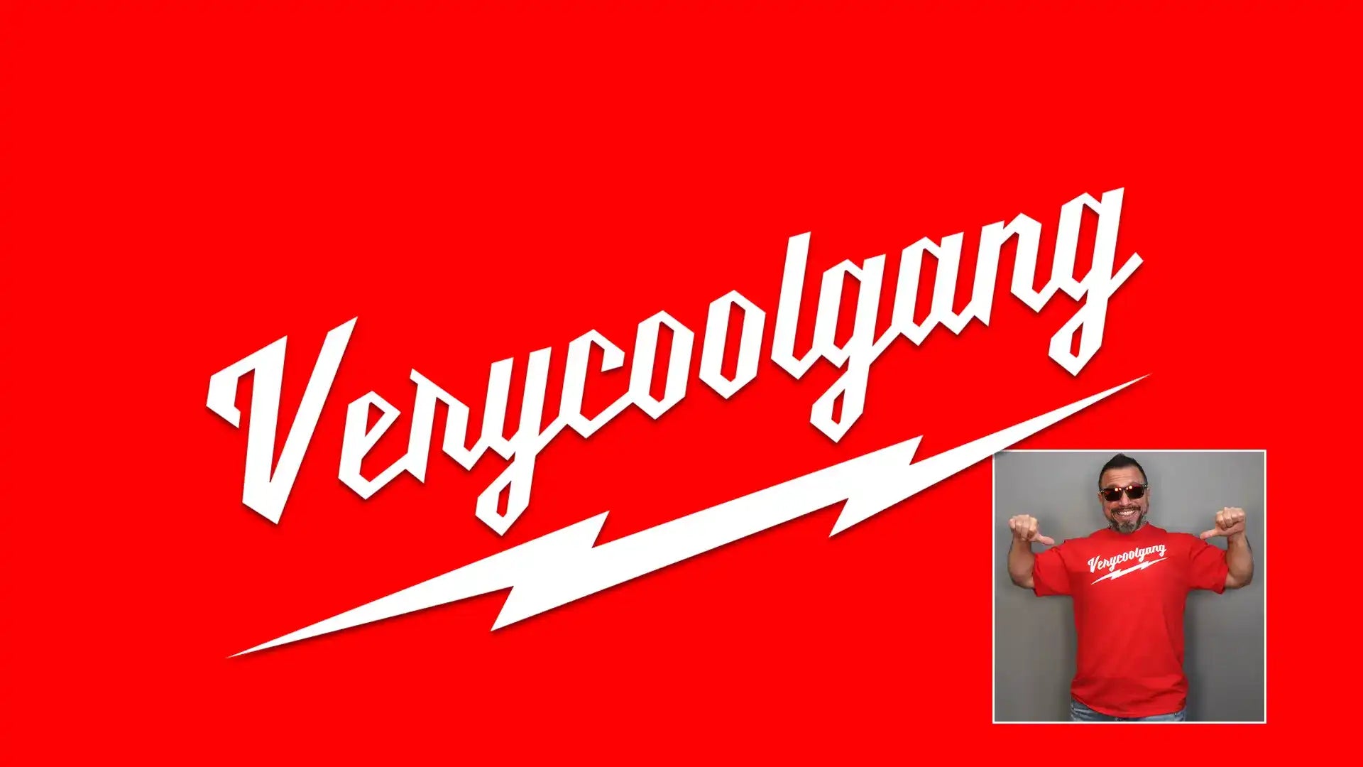 Red Background white VeryCoolGang stylized Logo Vince wearing Red Shirt pointing at logo with thumbs