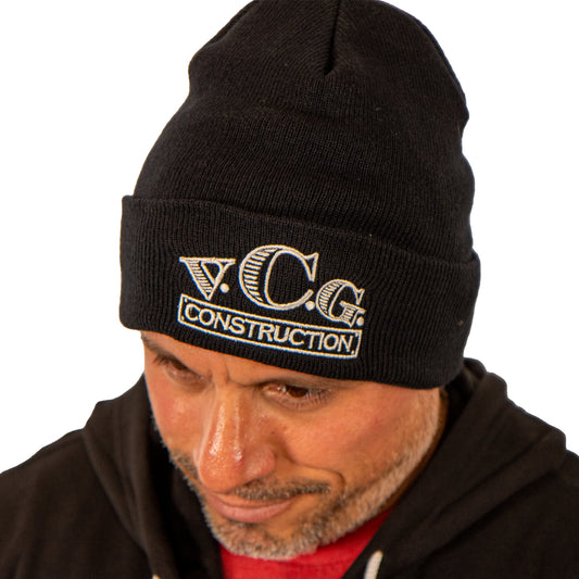 Model wearing VCG Construction black knit hat with head tilted down