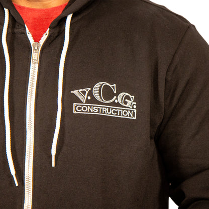 Front view close-up of VCG Construction black zip-up hoodie with embroidered logo