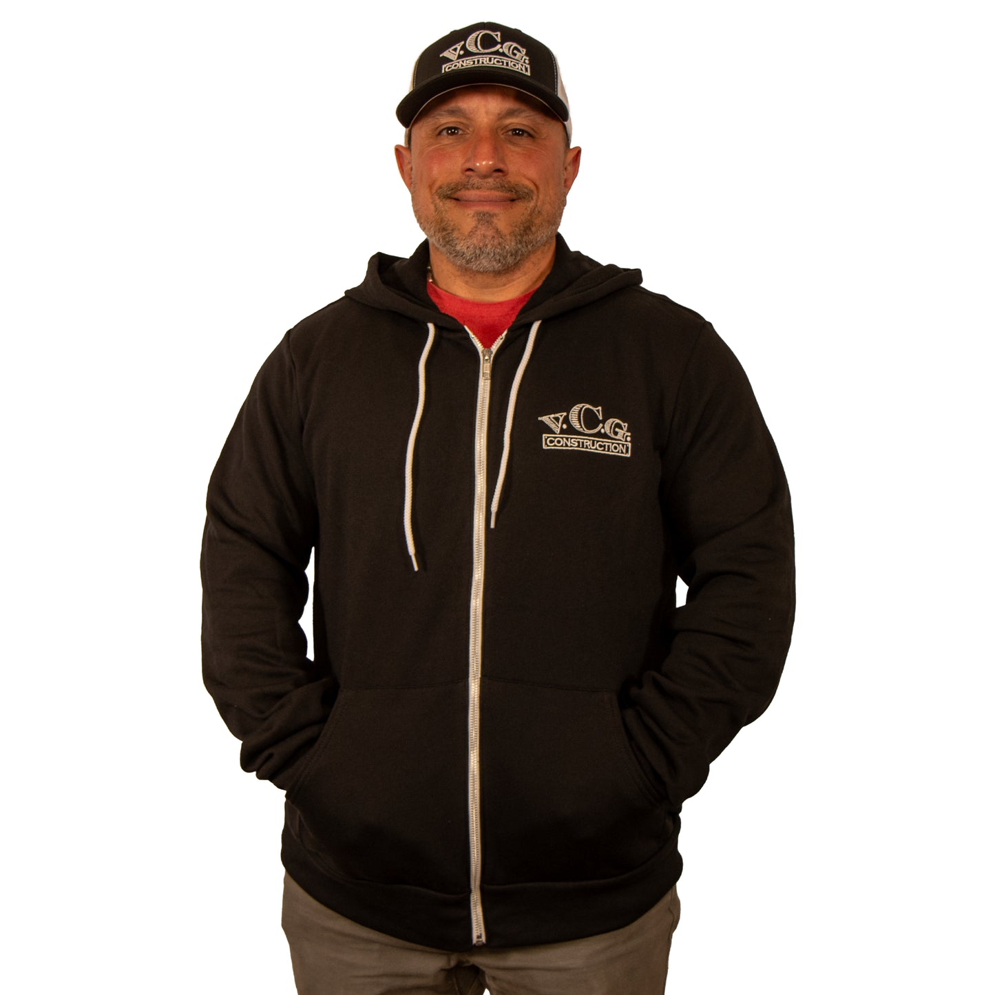 VCG Construction black zip-up hoodie with hands in pockets, front view