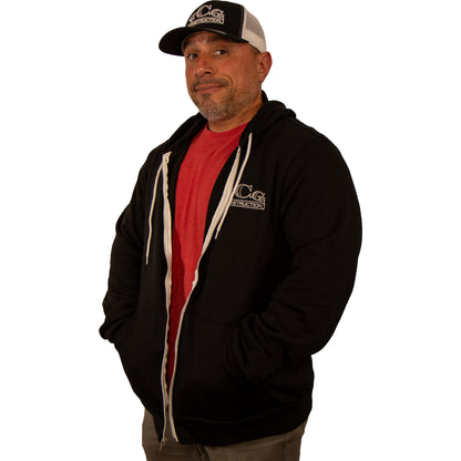 VCG Construction black zip-up hoodie unzipped with hands in pockets