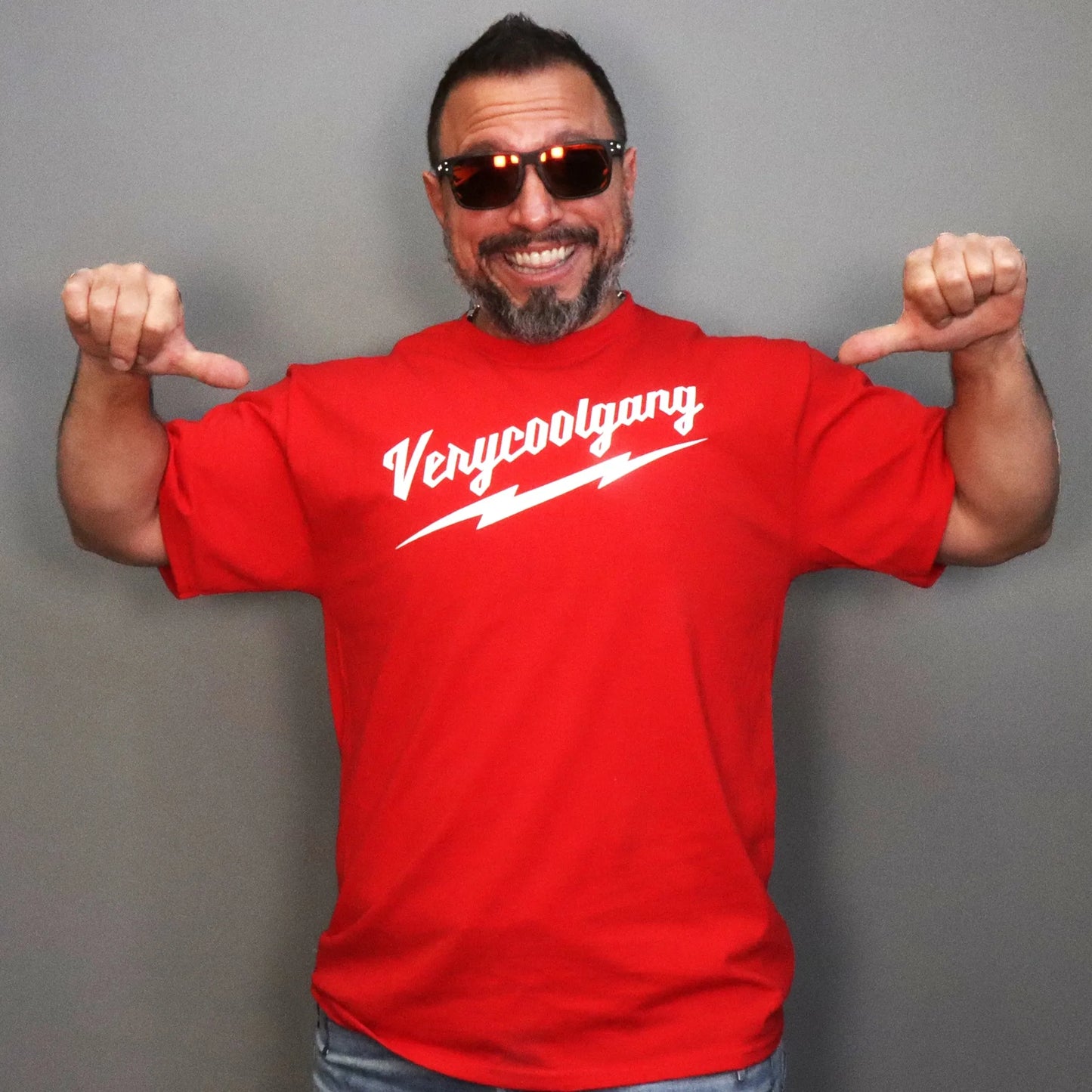 Limited Edition White VERYCOOLGANG Thunderbolt logo screen printed on vivid red T-Shirt - High-Quality Graphic Tee for a Stylish and Trendy Look