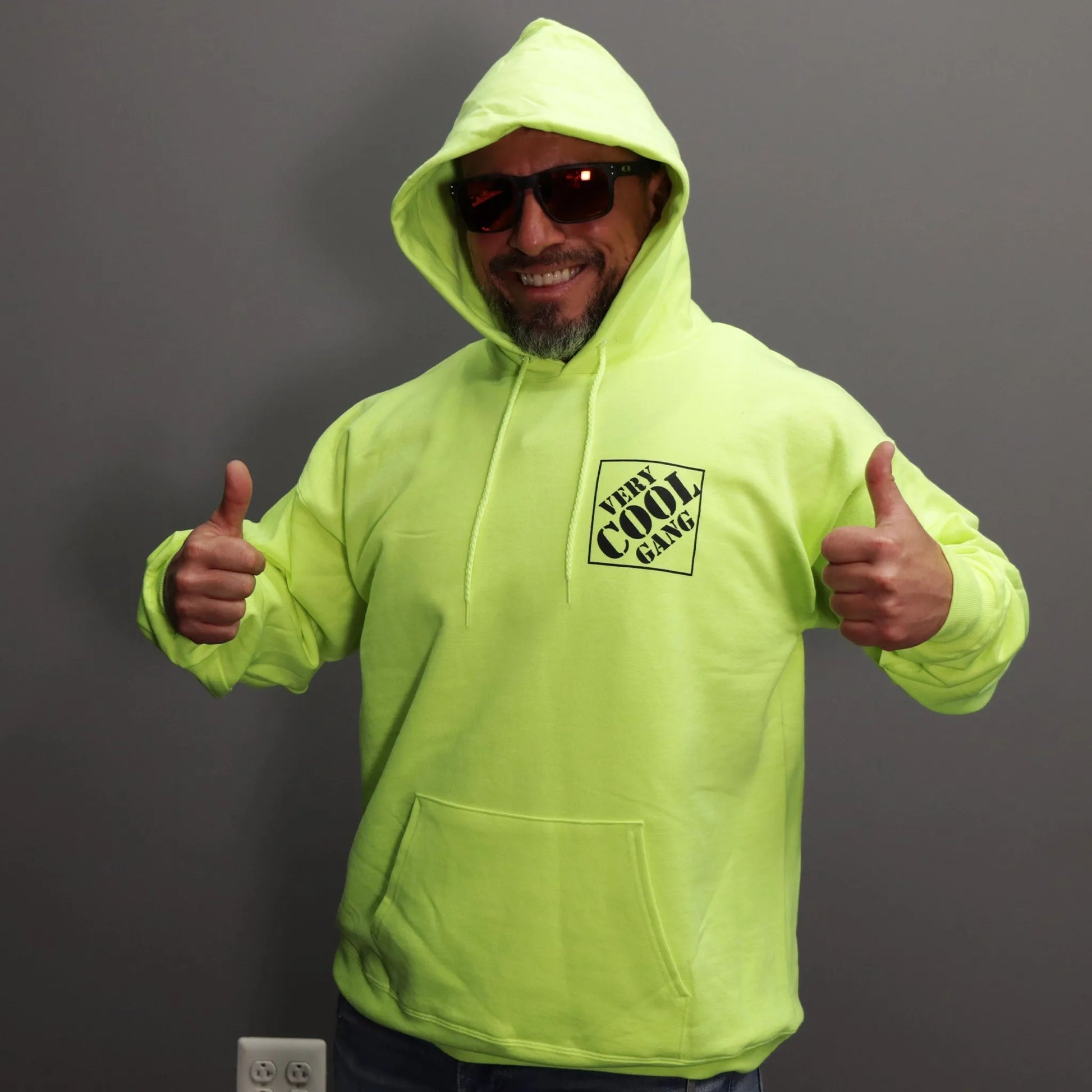 Logo of VCG Tool Deals in black is positioned on the left chest of a cozy Hi-Viz Green safety Hoodie, featuring a raised hood for added warmth and visibility.